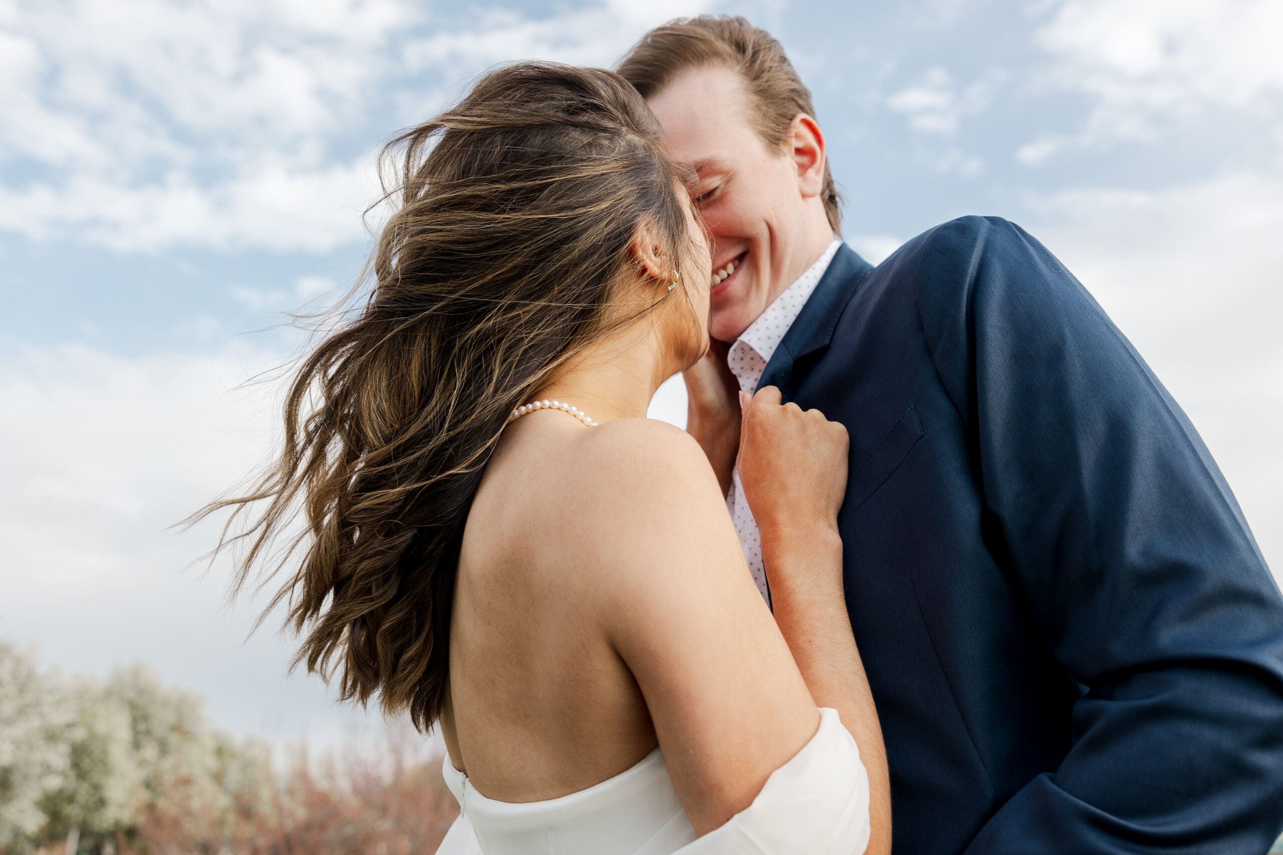 image of an engaged couple kissing