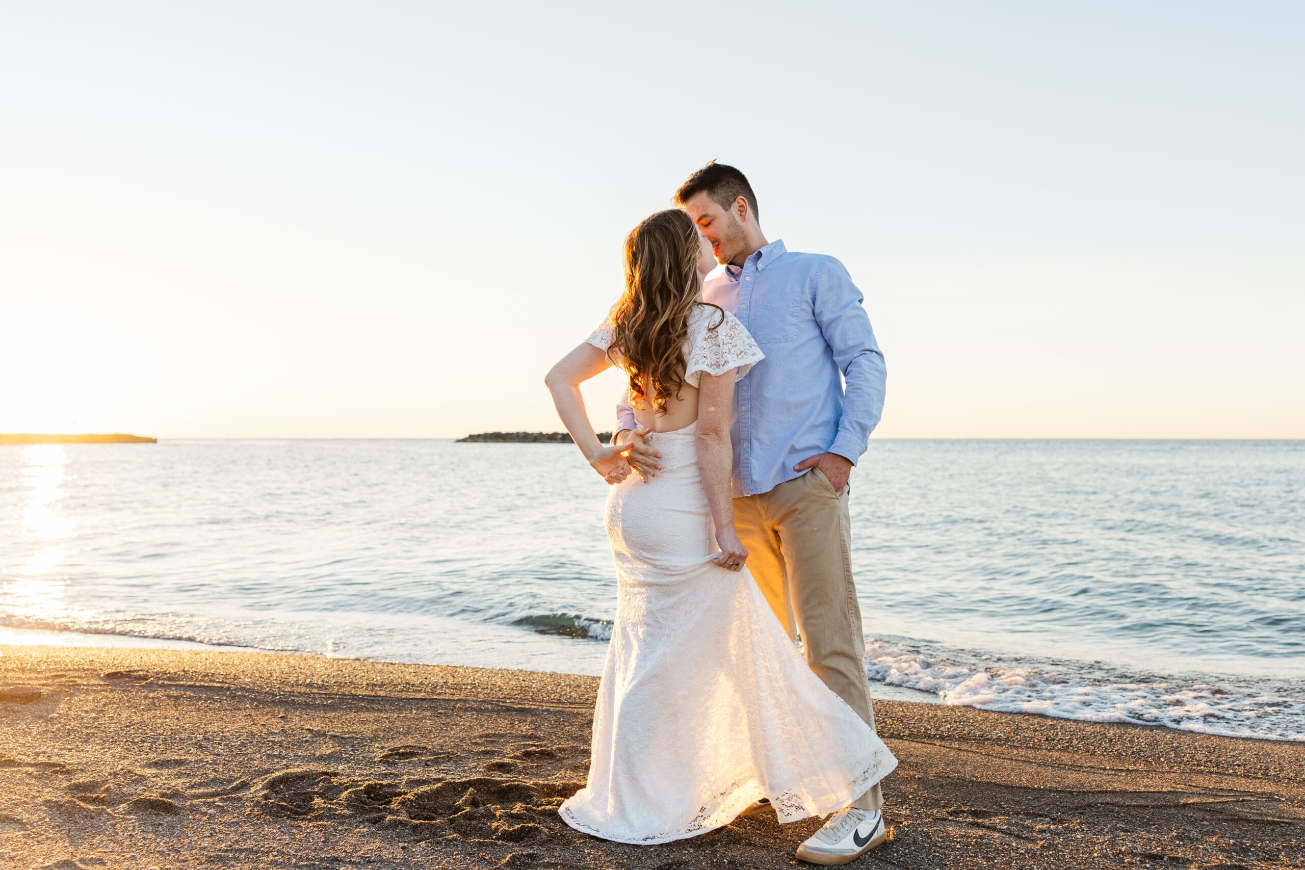 image of a couple sharing a romantic moment on the beach at sunset