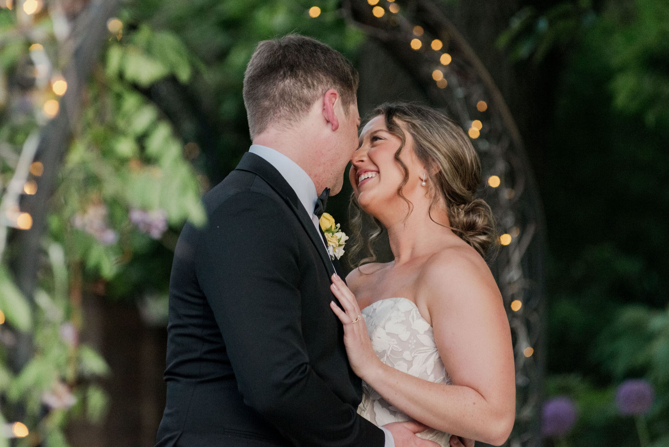 wedding image of a bride and groom looking at eachother and smiling