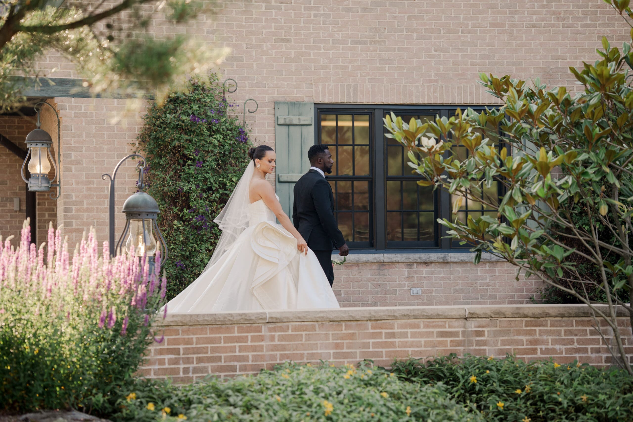 image of a bride and groom holding hands and walking